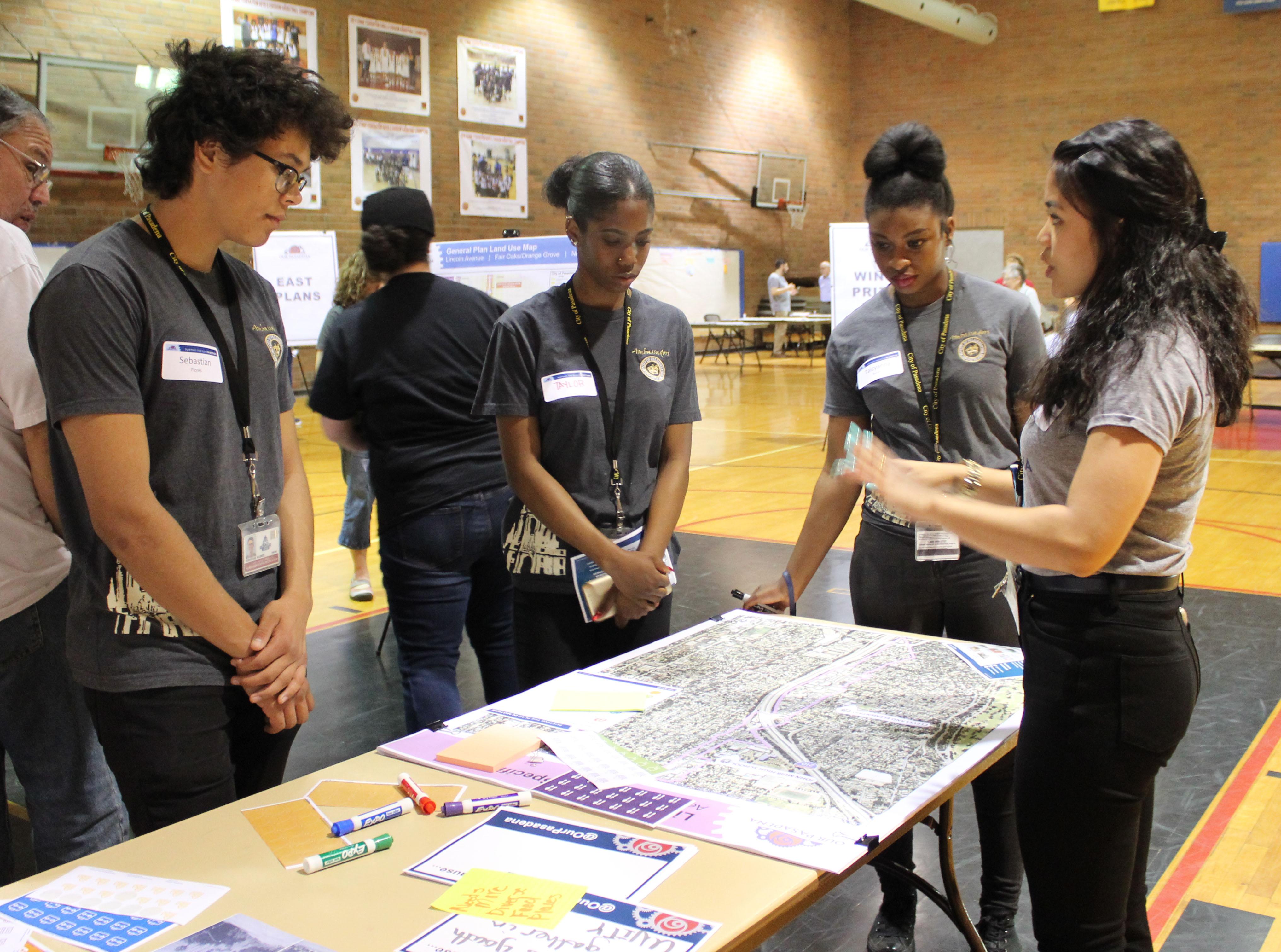 Youth Ambassadors learning about the Our Pasadena program at one of the City's open house
