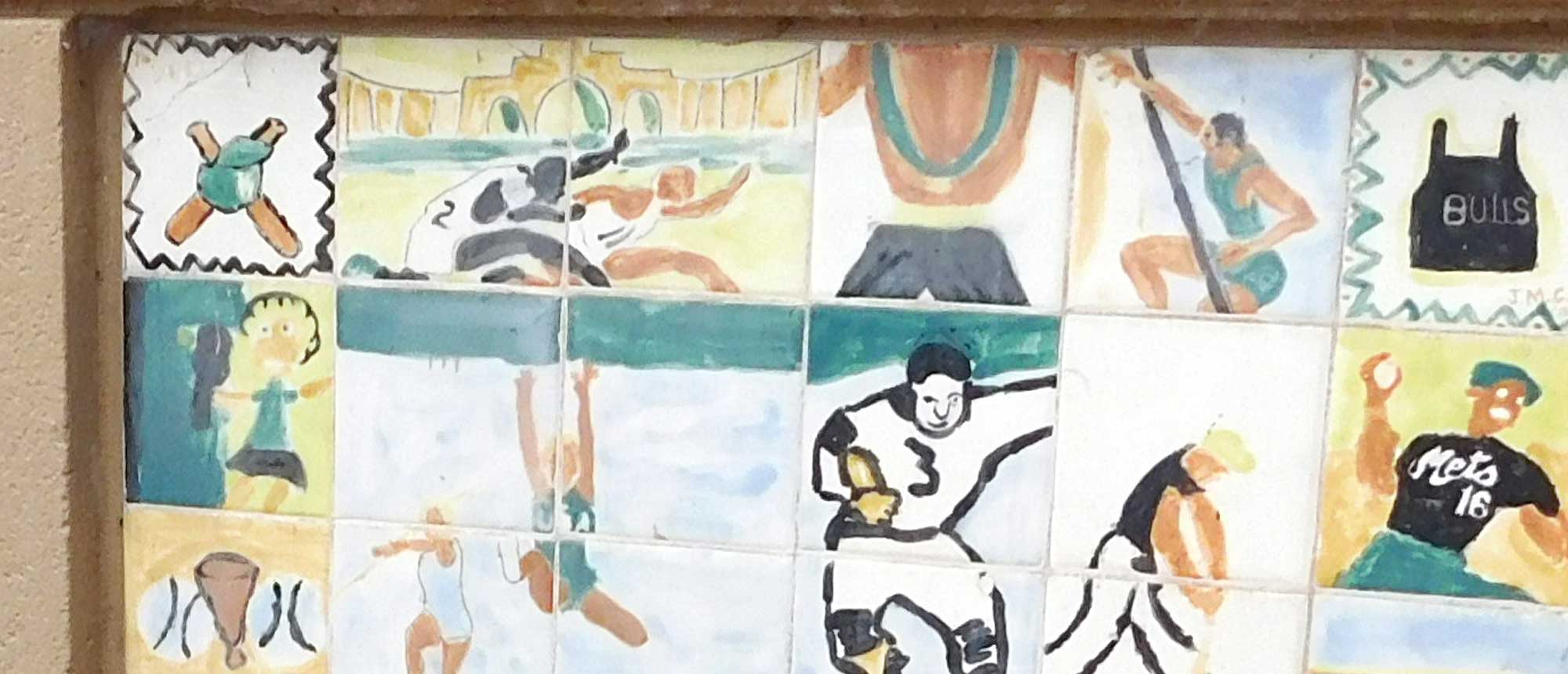 A tile mural depicting athletes doing various sports